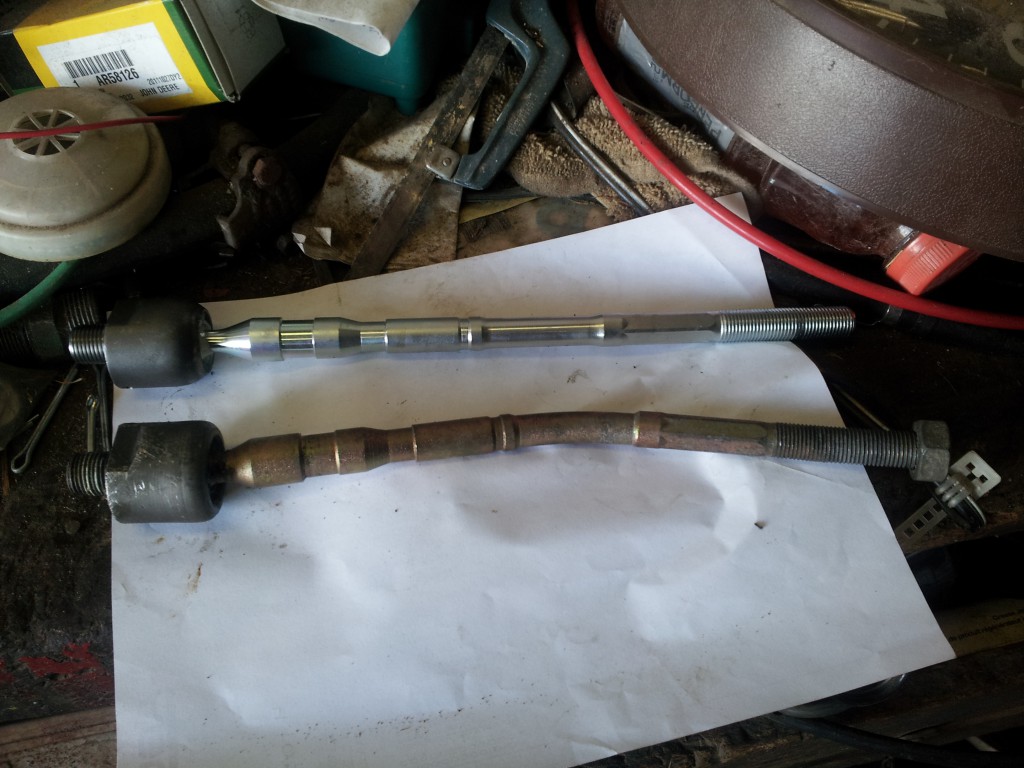 New inner tie rod next to the old worn one